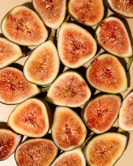 halved figs on a tan background