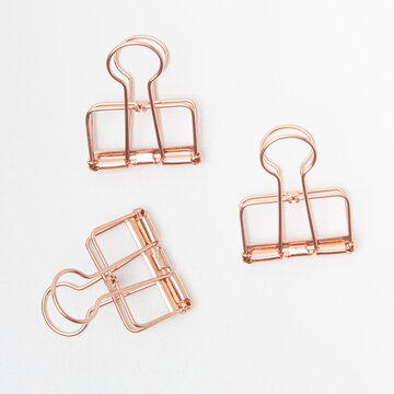 rose gold modern bider clips on a white background