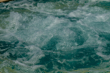 A blue pool shines on a summer day