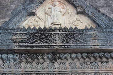 Intricate Stone Carving of Buddha in Ancient Temple
