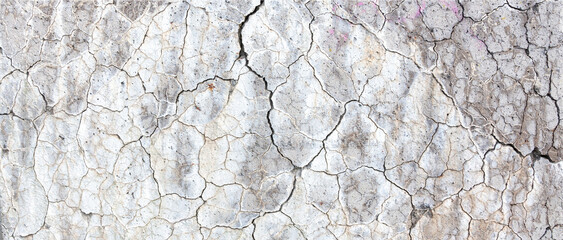 abstract line pattern on white painted part of conrete with cracks