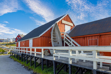 Typical architecture of Greenland Ilulissat with colored houses located near fjords and icebergs.