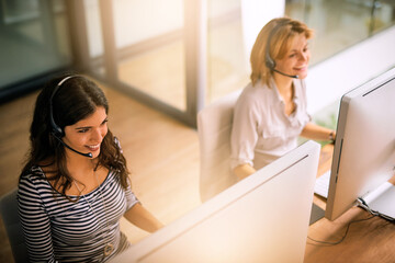 Call center, computer and contact us with business people in office for customer support, virtual...