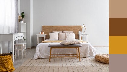 Interior of light modern bedroom with big bed, bench and table. Different color patterns