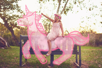 Child, imagine and unicorn for outdoor riding, girl and flower princess for fantasy adventure. Female person, kid and bench for playing dress up costume in nature, drawing and illustration for games © AK Coop/peopleimages.com
