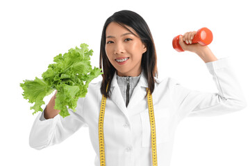 Female Asian nutritionist with lettuce and dumbbell on white background