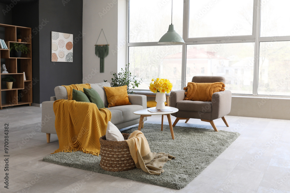 Canvas Prints Grey sofa, armchair, plaid and coffee table in beautiful living room