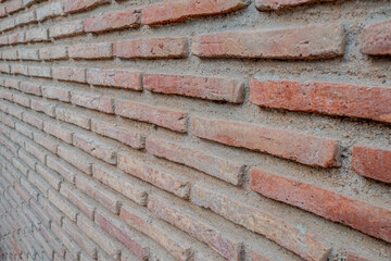 weathered classic red brick wall from unusual perspective