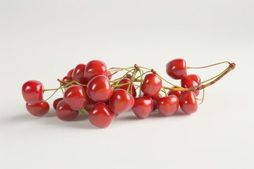 Fresh red cherries arranged beautifully on a light background, showcasing their vibrant color and natural shine.