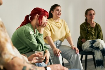 People engaging in a lively group discussion, sharing thoughts and experiences. Casual setting with...