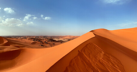 Sand dunes in the Sahara desert, dune edge, Algerian part of the Sahara in the Tadrart and Tassili n'Ajjer mountains