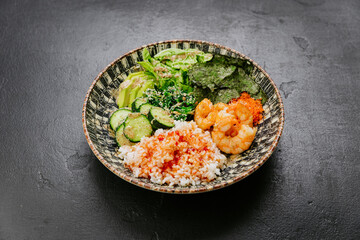 Shrimp poke bowl with rice, seaweed, avocado, and cucumber - fresh and healthy Asian-inspired dish