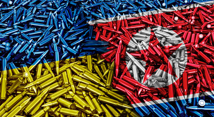A large pile of bullets for automatic weapons in the form of Ukraine and North Korea flags, concept of military conflict