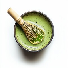 cup of matcha tea with bamboo whisk
