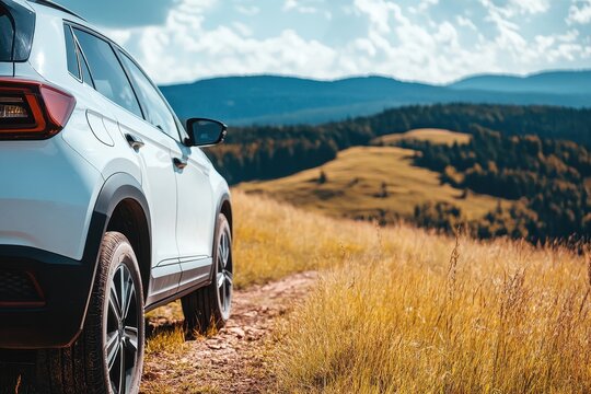 White SUV crossover in nature with detailed photo of headlights wheels and parts All wheel drive off road vehicle for family adventures in the city