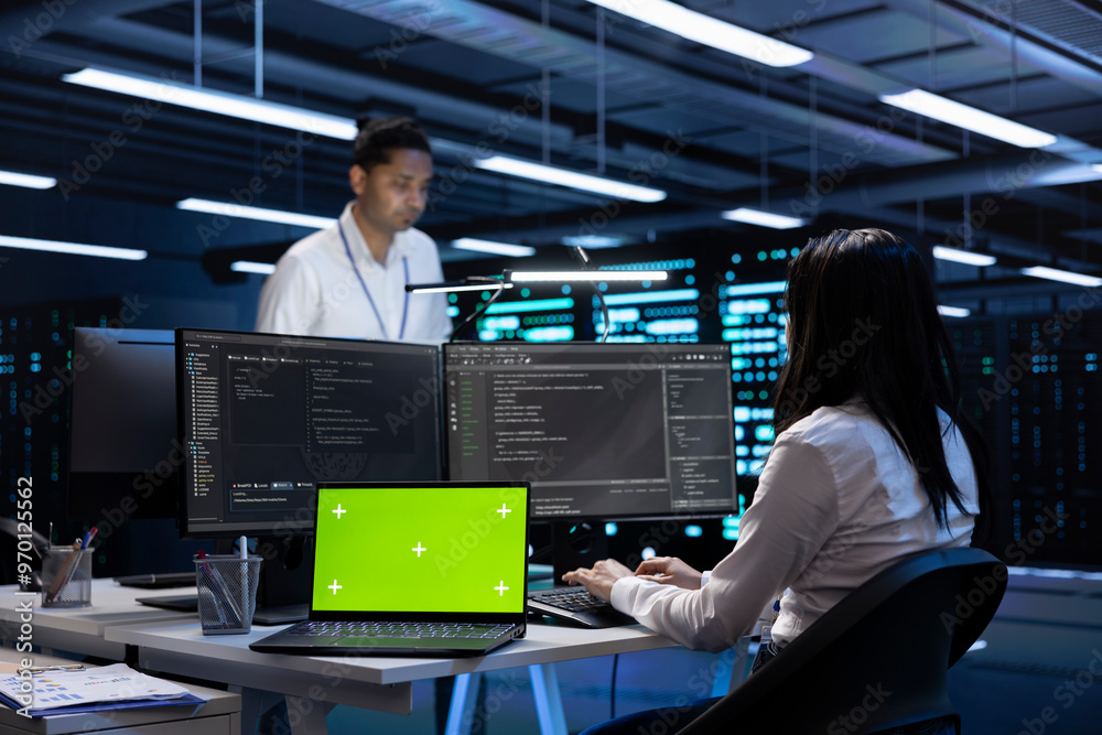Poster green screen laptop in high tech facility delivering immense computing power, capable of processing 
