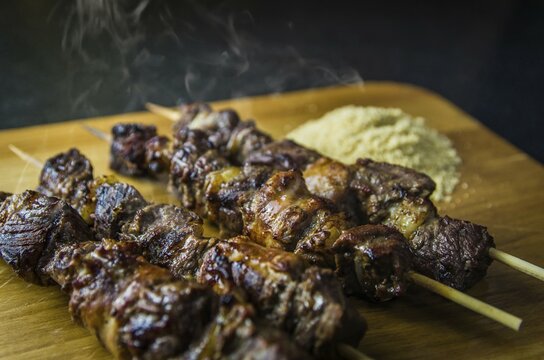 Juicy meat barbecue skewer (Churrasquinho, espetinho) in close up