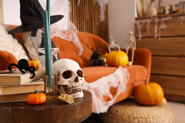 Creepy sofa and coffee table decorated for Halloween celebration in living room