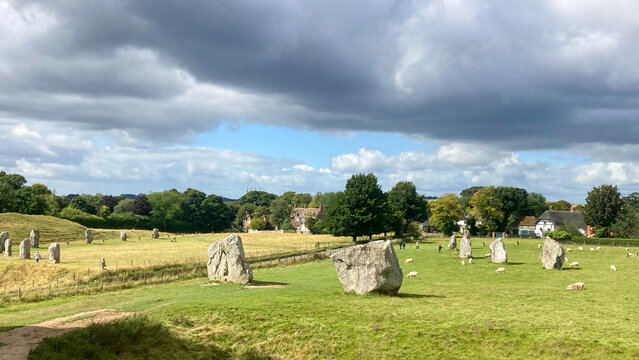 Avebury landscape with sky and clouds at a historic stone circle. Wilsthire solstice site.