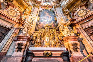 Ornate altar with gold and marble detailing in St. Nicholas Church. Mala Strana, Prague, Czech...