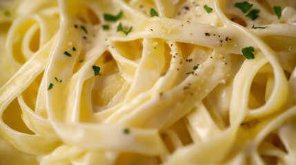 a close-up, top-down view of fettuccine alfredo, filling the entire frame with the focus on the pasta's intricate details