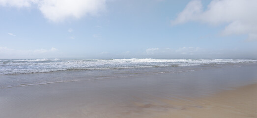 A beach lifestyle backgound with horizon,surf waves, sand and sky elements and copy space