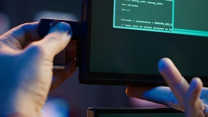 Hacker inserting USB in computer after managing to steal sensitive data, close up. Scammer uploading storage drive into PC after obtaining sensitive information from users using malware, camera A