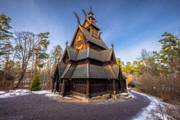 Oslo - February 11 2023: The epic medieval Gol Stave Church in the open air museum of Oslo, Norway - obrazy, fototapety, plakaty