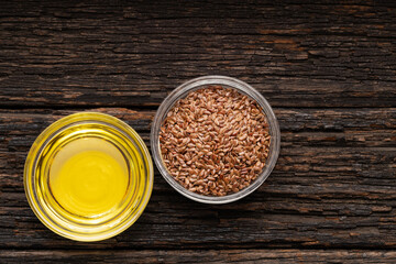 Healthy flaxseeds - Linum usitatissimum oil in glass bowl