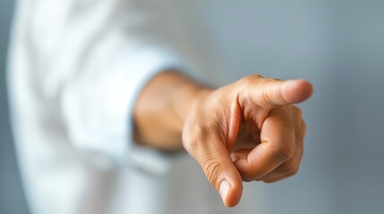 Naklejka premium Close-up of a Hand Pointing at Something