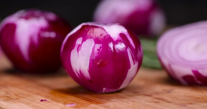 peeled red onions on a chopping board, preparing red onions for cooking in dishes