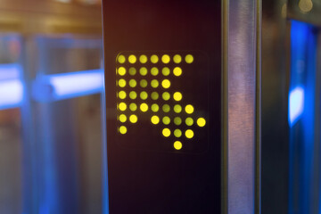 Pointer arrow on an electronic turnstile close-up