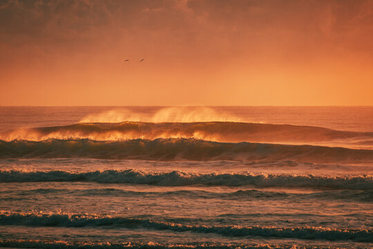 Sunset waves crashing 
