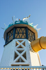 A creatively designed tower featuring a yellow slide at a modern playground in Wellington, New Zealand