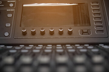 The volume control knob of a digital audio mixer.