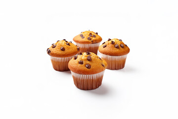 Four delicious freshly baked muffins with chocolate chips on top. Close up, isolated on a white background.