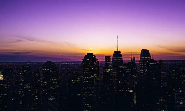 Timelapse Drone Shot of City Sunrise Over Skyscrapers