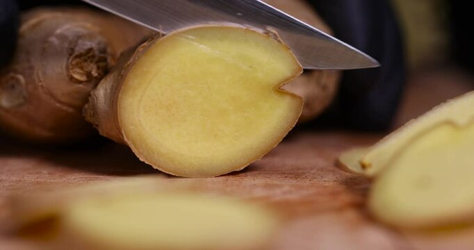 sliced ginger root on the table, details of the ginger root used in cooking sliced into pieces