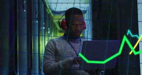 Image of financial data processing over african american businessman in server room
