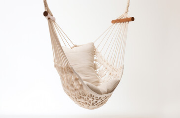 Fototapeta premium a hammock chair with a woven cotton seat and wooden spreader bar