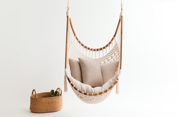 Obraz premium a hammock chair with a woven cotton seat and wooden spreader bar