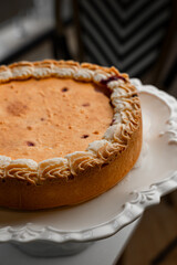 Cheesecake with golden crust and white cream