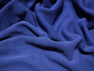 wavy abstract background made of blue fabric