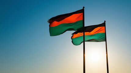 Two Malawian Flags Waving in the Sunset