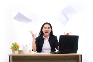 Stressed tired businesswoman feels exhausted sitting at office desk with laptop and crumpled paper, frustrated woman can not concentrate having writers on white backround. Asian Businesswoman Throwing
