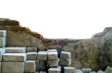 Pile of bricks under a collapsed wall on an isolated white background