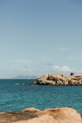Tropical blue water looking over to a sail boat