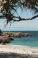 Clear blue water and white sand beach