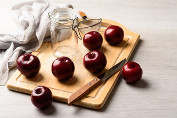 Fresh red plum on white background