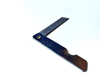 Close up of a folding knife isolated on white background.